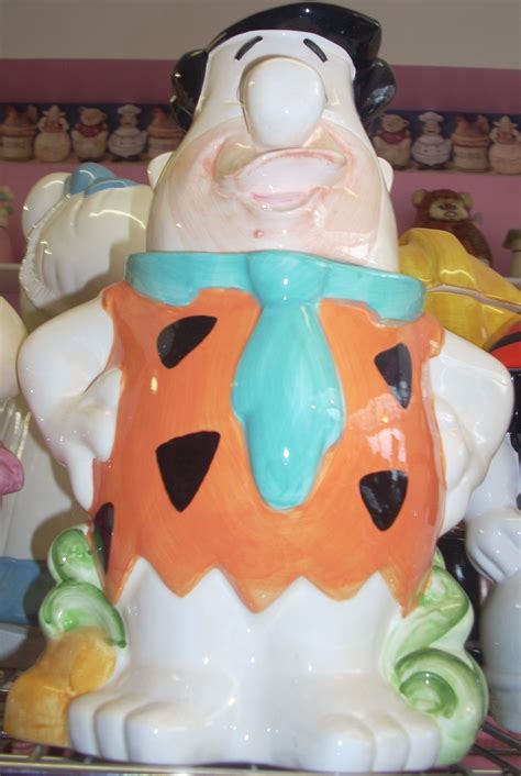 The cookie jar features Fred, Wilma, Pebbles and Dino in the family car. . Fred flintstone cookie jar